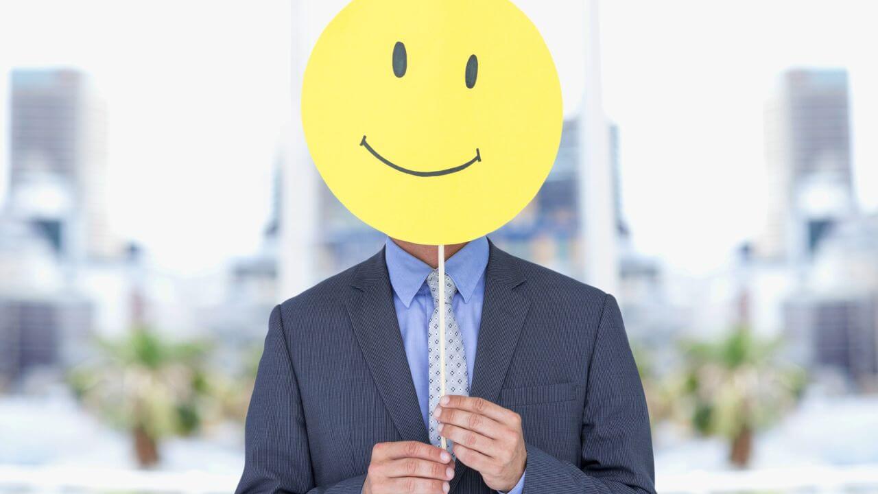 Businessman Holding a Happy Smiley Face