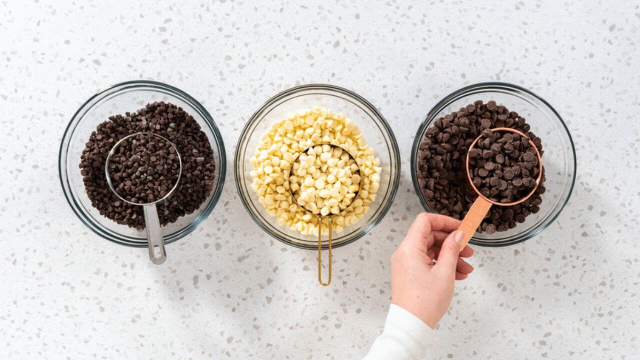 Chocolates in measuring cups and bowls