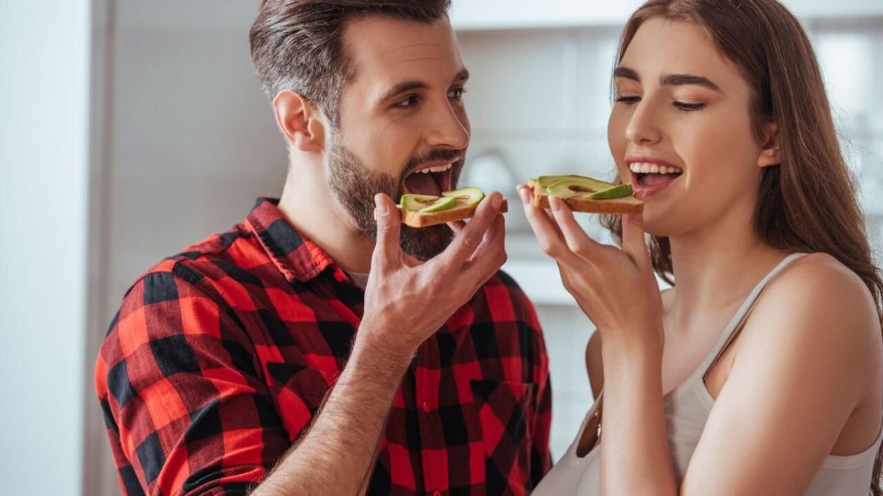 Couple Easting Delicious Toast With Avocado