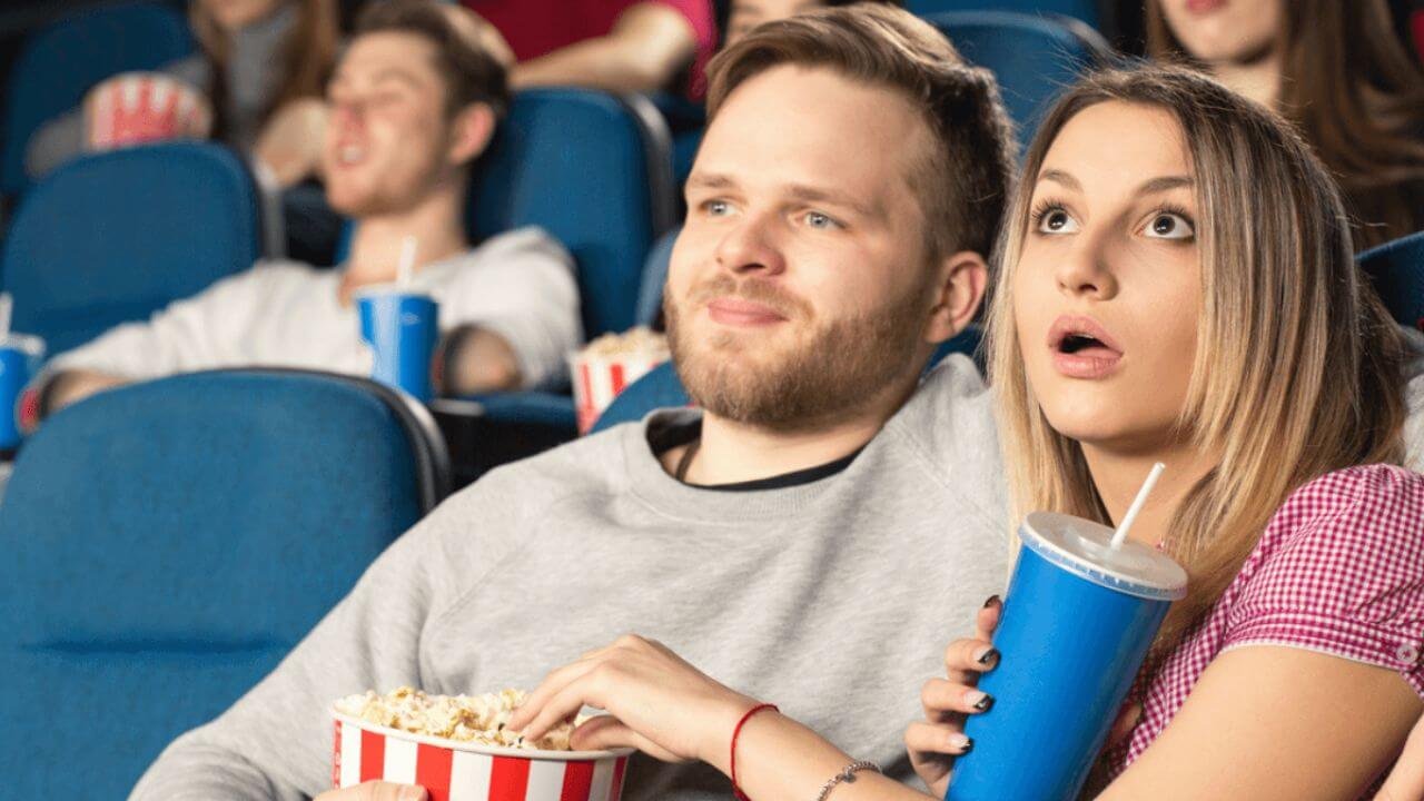 Couple Watching With Popcorn