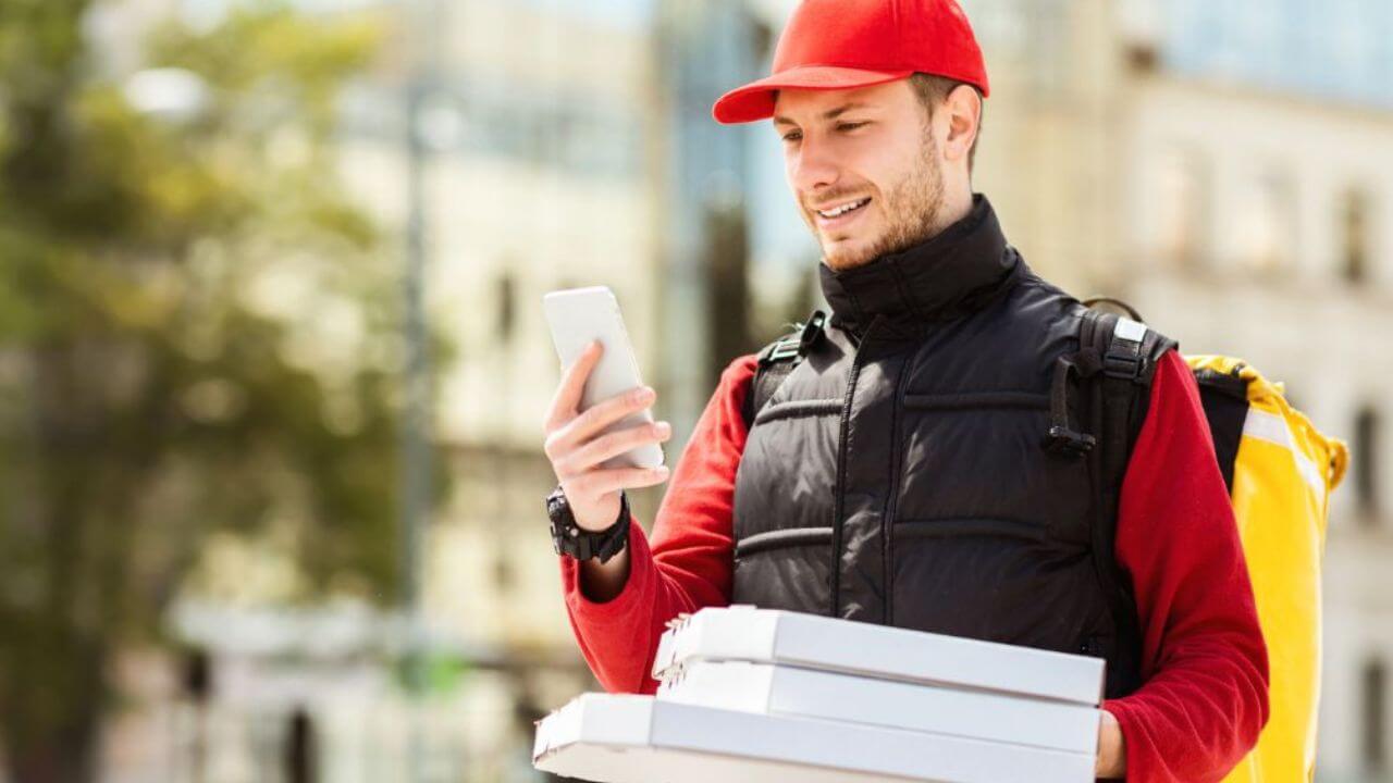 Fast Food Employee Delivering Pizza