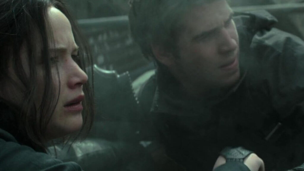 Jennifer Lawrence and Liam Hemsworth in The Hunger Games Mockingjay - Part 1 (2014)