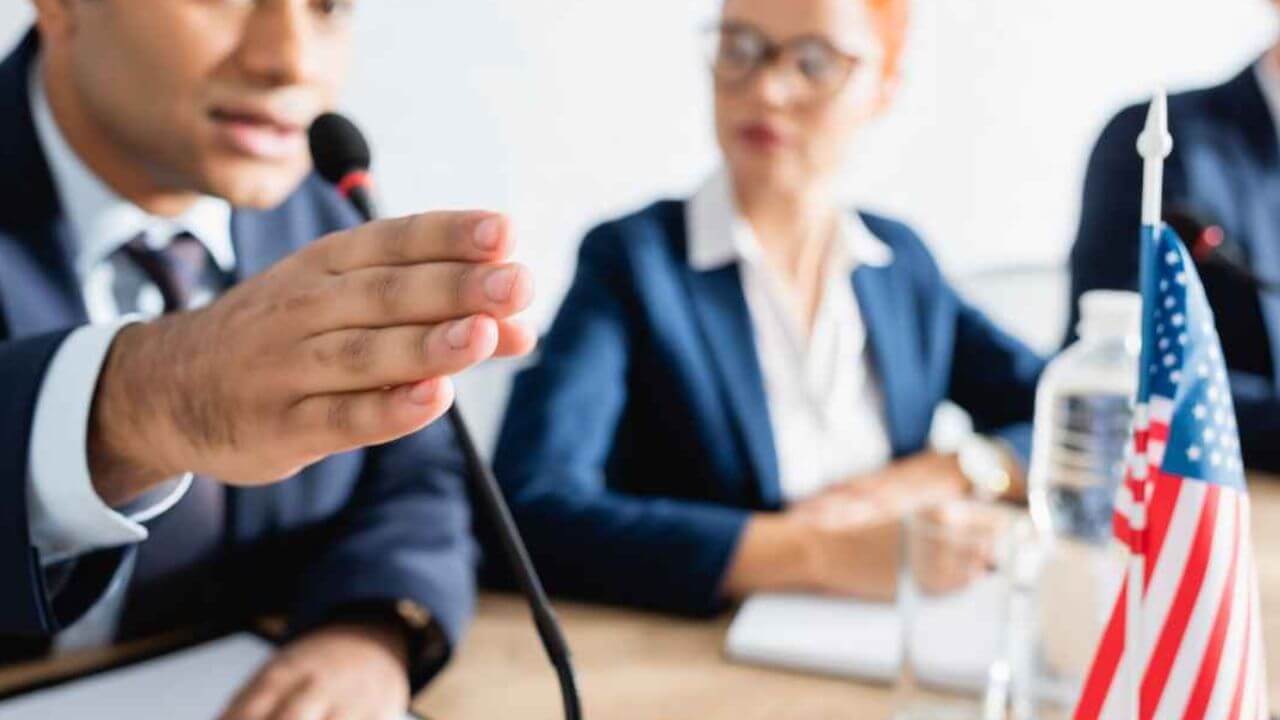 Politician Speaking Into a Microphone