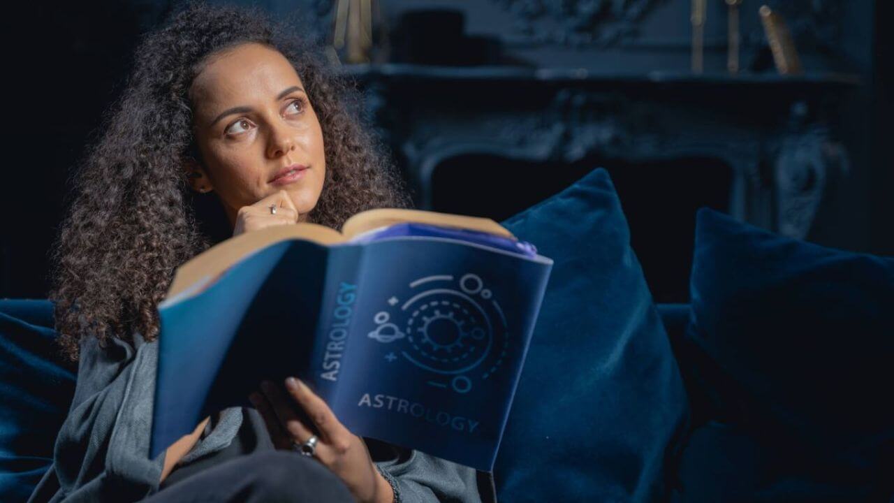 Woman Reading Astrology Book