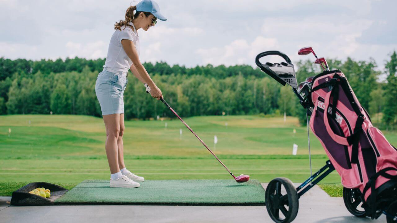 Woman Playing Golf at Golf Course